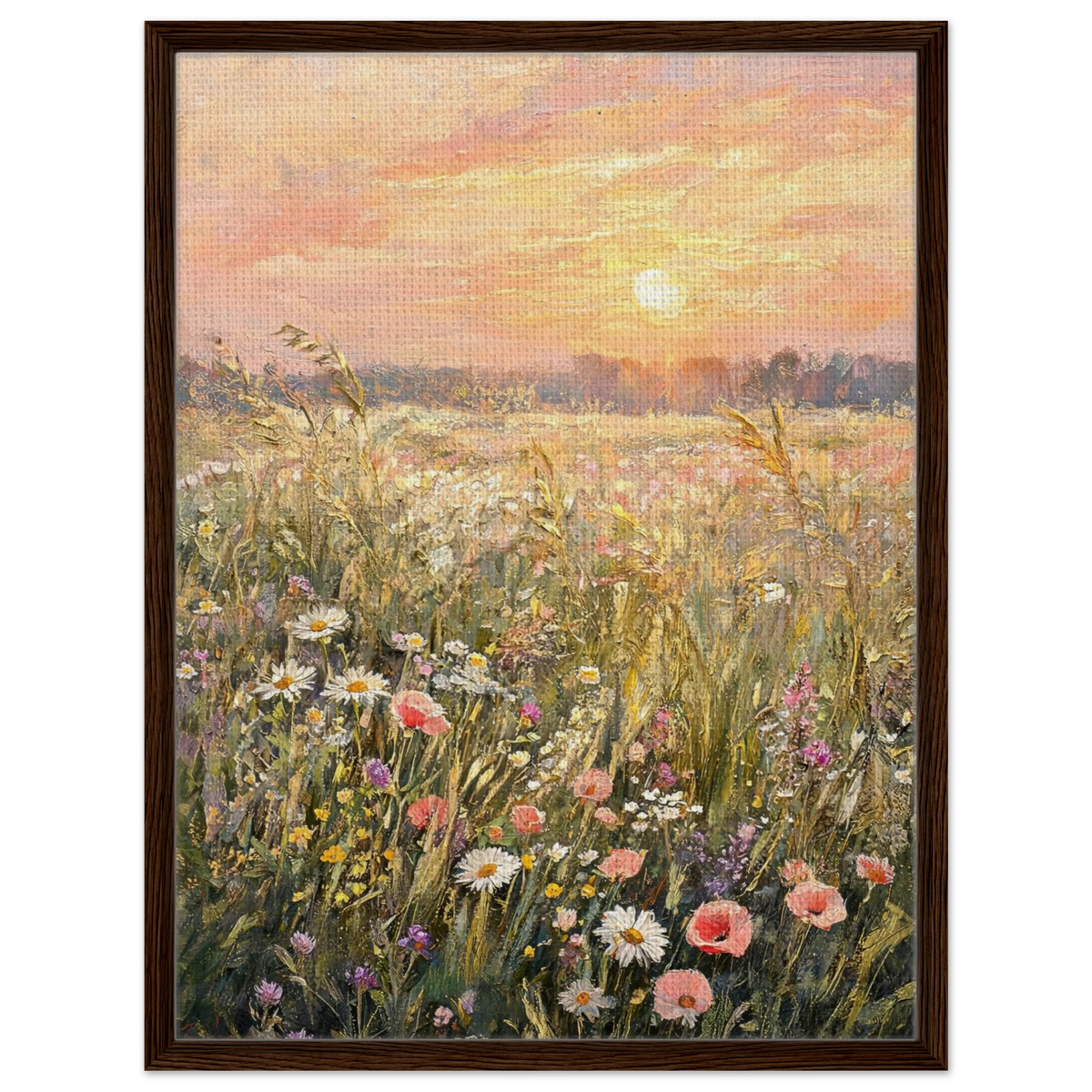 A framed canvas art print depicting a vibrant wildflower meadow at sunset, featuring a warm orange and pink sky with a glowing sun over a field of pink, white, and yellow flowers. The artwork is housed in a dark brown wooden frame and is shown against a clean white background.