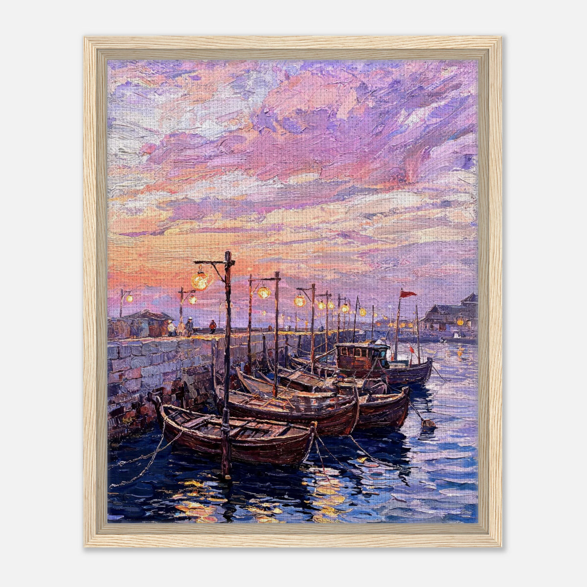 A framed canvas print of an impressionist painting depicting wooden boats moored in a harbor under a pink, purple, and orange sunset sky.