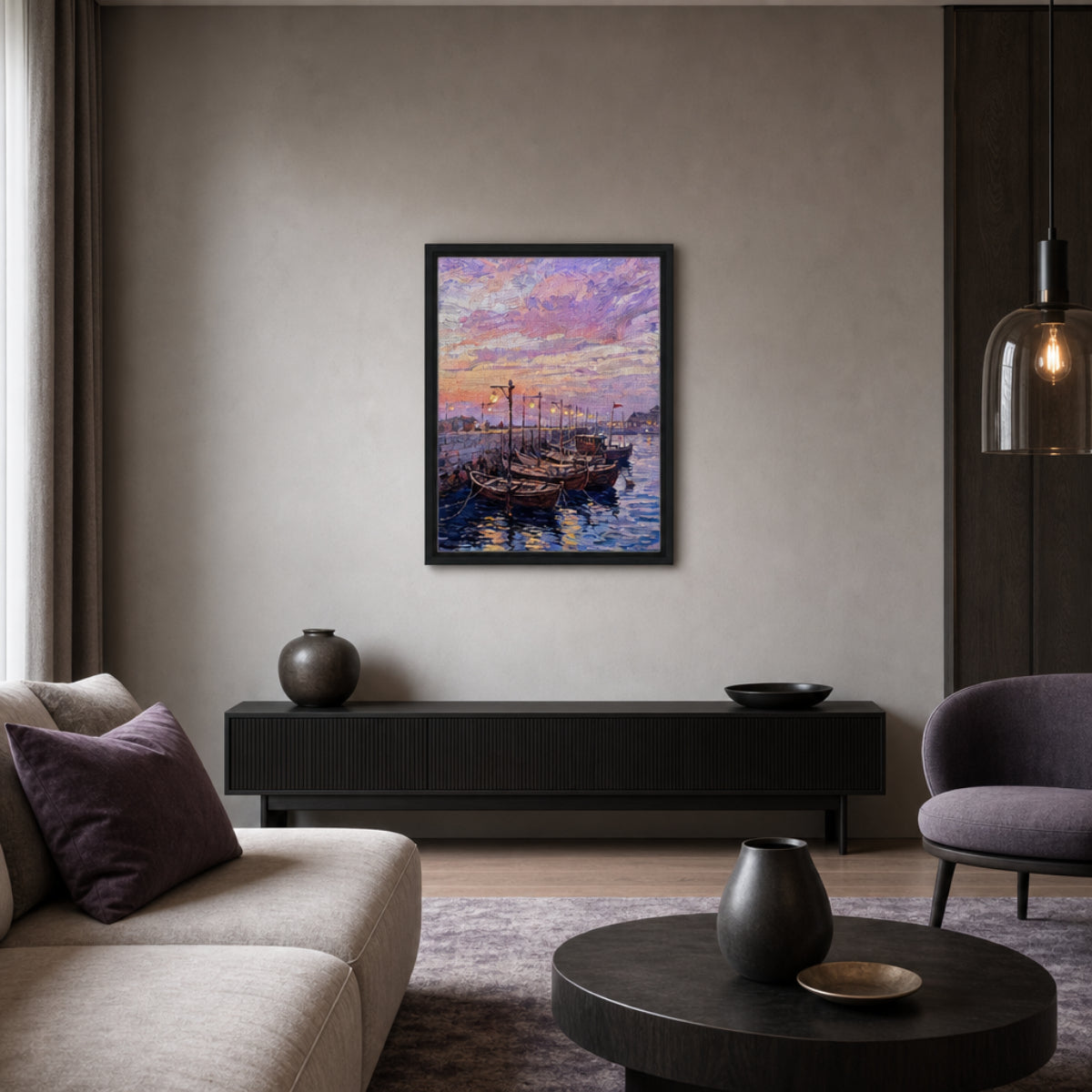 A framed art print depicting traditional wooden boats on water under a purple and pink sunset sky, displayed on a neutral wall in a modern living room setting.