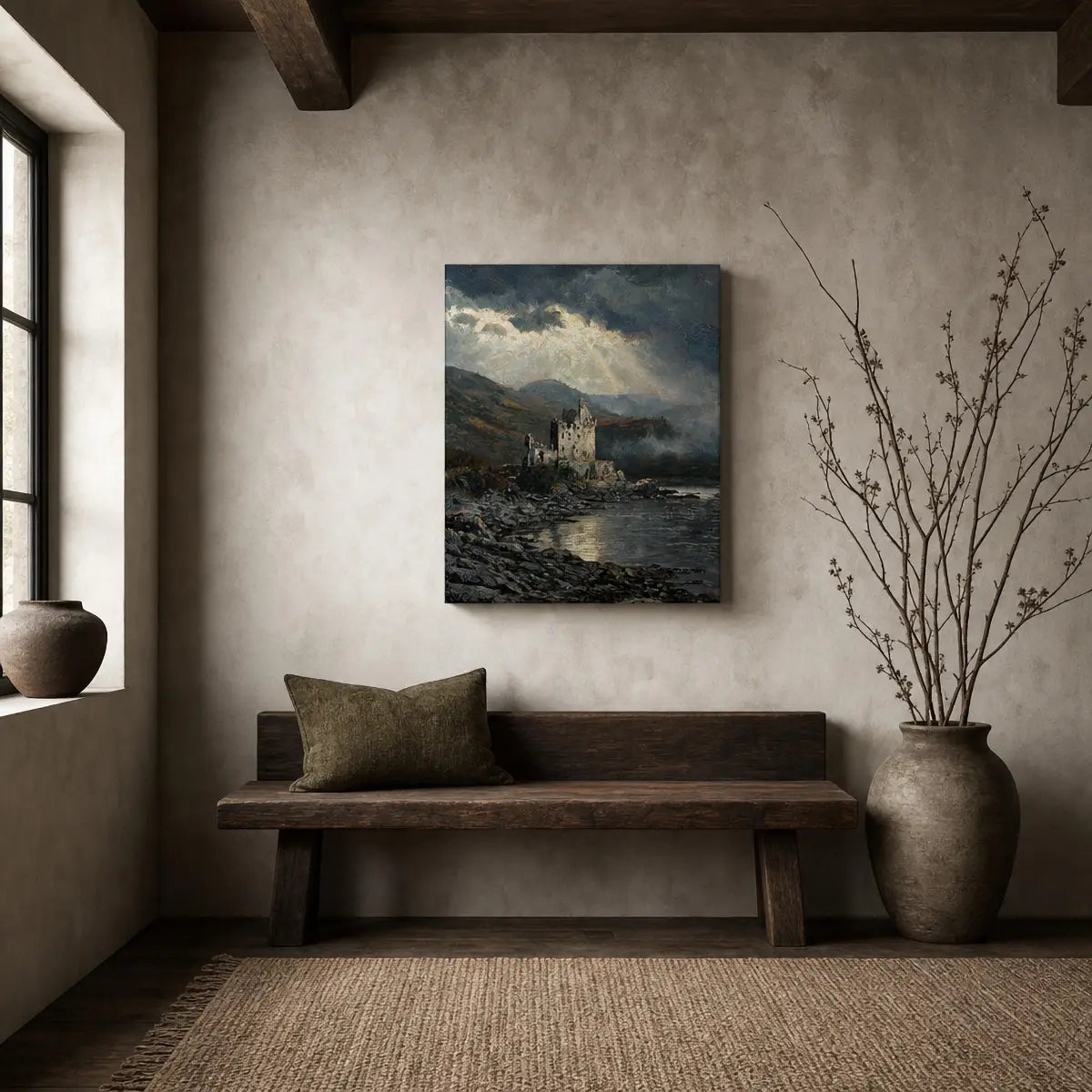 A vertical canvas print of a moody coastal castle painting hangs on a textured beige wall above a rustic wooden bench in a styled room setting.