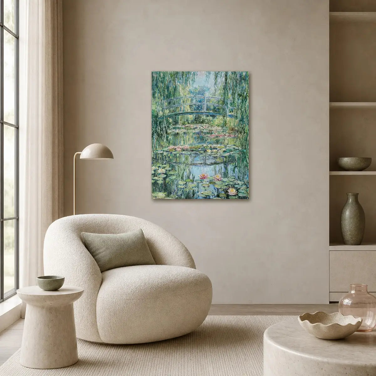 A vertical canvas print of a Monet-style water lily pond scene hangs on a beige wall in a modern, minimalist living room with a cream-colored armchair, side table, and lamp.