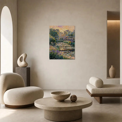 An impressionist landscape painting of a pond with bridges and flowers hangs on a beige wall in a modern, minimalist living room with cream-colored furniture.